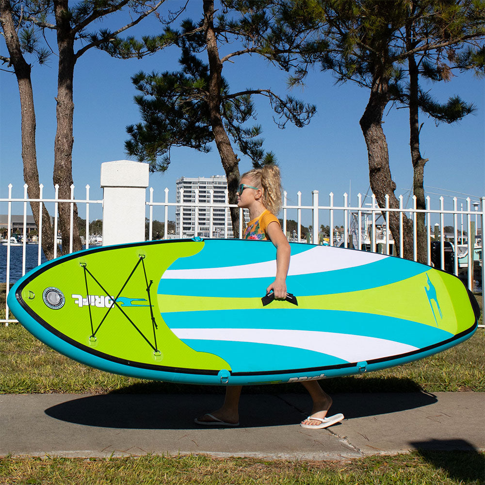 a kid carrying a kids drift paddle board